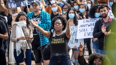 A woman gestures during a rally against anti-black racism in Vancouver on Friday. Anti-racism protest