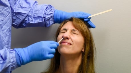 Tracy Sanden works at a COVID-19 testing site and said she was asymptomatic but wanted a better understanding of the process. COVID-19 testing nasal swab Saskatchewan Health Authority