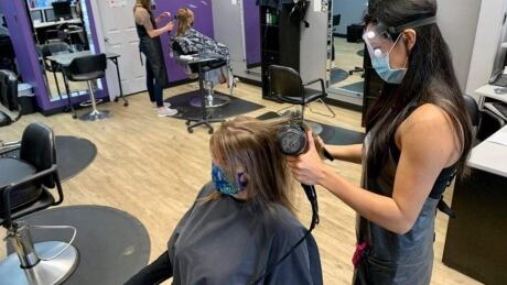 Salon owner Destinee Peter and her stylists are giving back to their community with free hair cuts. tangles salon