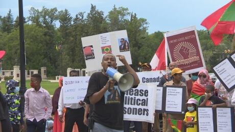 About 100 people marched to the Legislative Building in Regina on Friday, calling for an independent and impartial review of the assassination of a prominent artist and activist. Ethiopia justice march July 10 2020 Regina