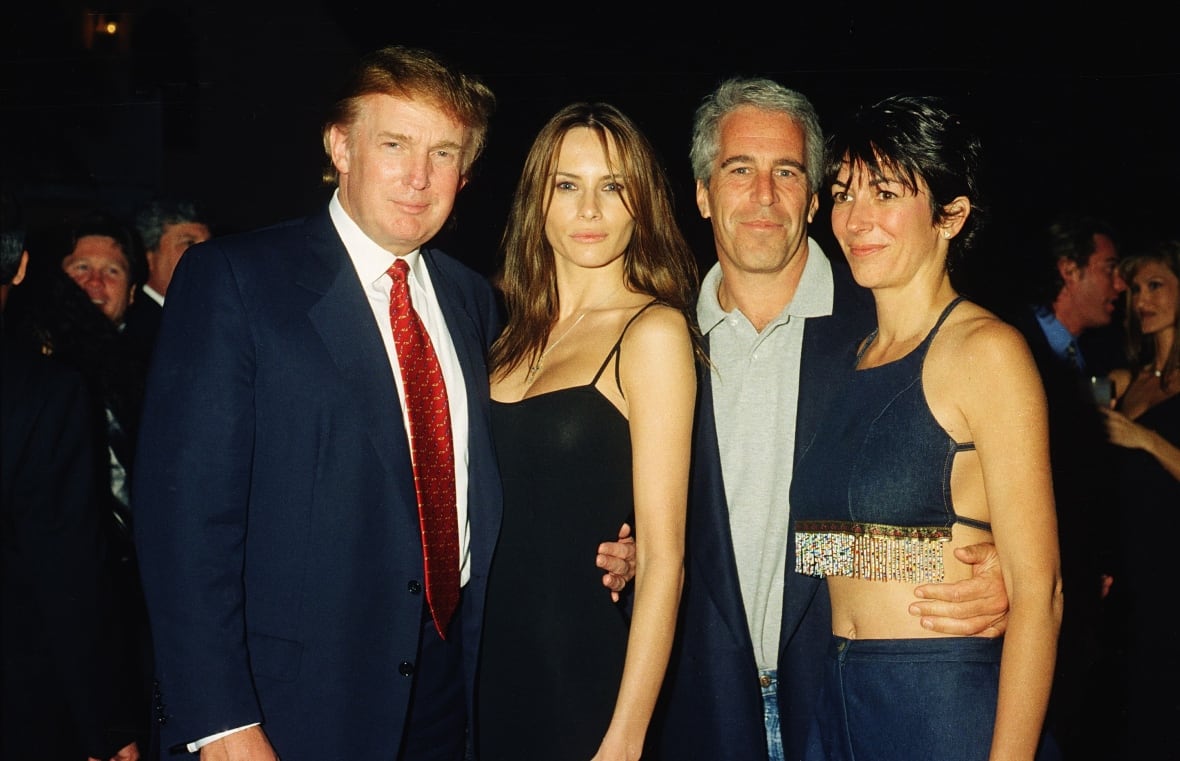 Two men and two women standing together two men, both men, women around women, all smiles