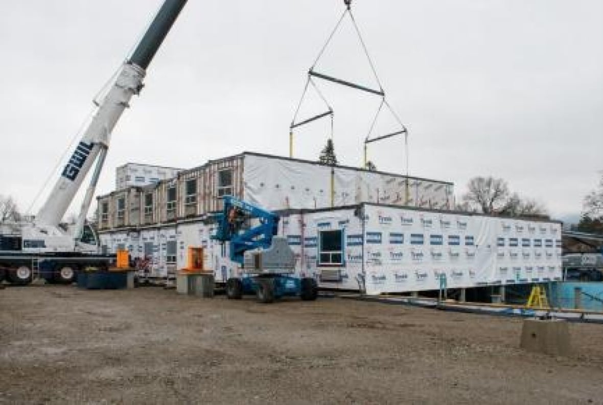 modular housing project with crane