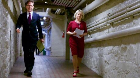 Health Minister Adrian Dix and Provincial Health Officer Dr. Bonnie Henry walk through the basement of the legislature on their way to Thursday's COVID-19 briefing in Victoria, B.C. COVID-19 update