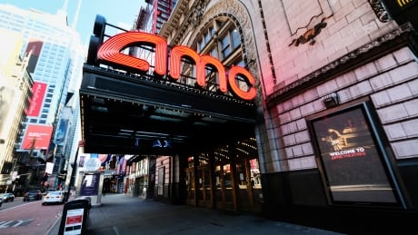 FILE - In this May 13, 2020 file photo, AMC Empire 25 theatre appears on 42nd Street in New York. The nation’s largest movie theater chain changed its position on mask-wearing less than a day after the company became a target on social media for saying it would defer to local governments on the issue. AMC Theaters CEO Adam Aron said Friday that its theaters will require patrons to wear masks upon reopening, which will begin in July. (Photo by Evan Agostini/Invision/AP, File) Film-AMC Theaters-Mask Policy