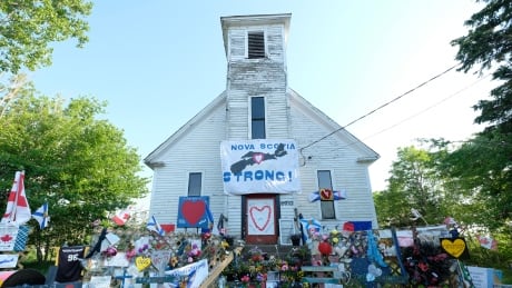 Months after the mass killing that began in Portapique, N.S., a memorial remains at a local church. Portapique church Nova Scotia strong