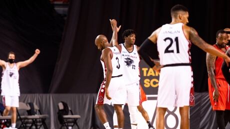 Ottawa's Johnny Berhanemeskel and Shaquille Keith high-five each other during the BlackJacks' 78-76 win over the Fraser Valley Bandits at the CEBL Summer Series on Thursday. berhanemeskel-johnny-073020