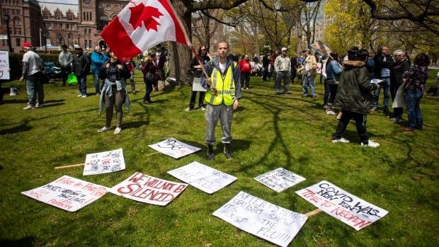 COVID-19 conspiracy theories creating a 'public health crisis' in Canada, experts say