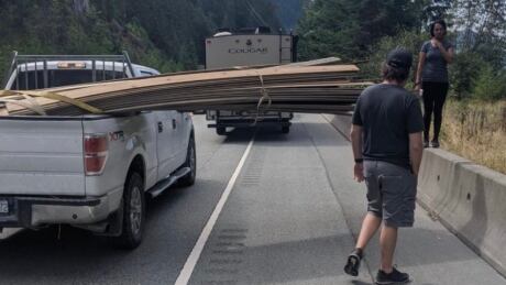 A cyclist says he was hit by this load of wooden planks hanging over the side of a pickup truck on Vancouver's Sea to Sky Highway on Sunday. Todd Nickel cyclist hit
