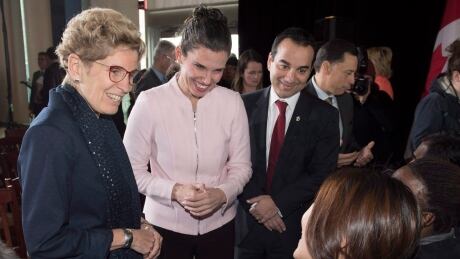 Liberal MP Michael Levitt (right), with then-Ontario Premier Kathleen Wynne (left) and Federal Science Minister Kristy Duncan chat with students after a groundbreaking ceremony for the Centennial College Downsview Aerospace Campus in Toronto in November 21, 2016. Centennial Aerospace 20161121