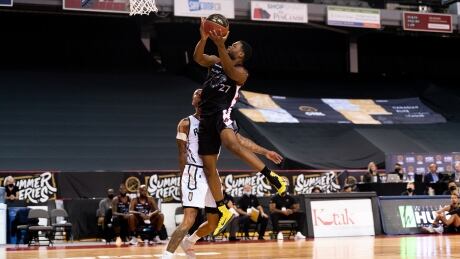 Ottawa's Lloyd Pandi, right, rises for a jumper against a Saskatchewan defender during the BlackJacks' 87-68 win over the Rattlers at the CEBL Summer Series on Wednesday. pandi-lloyd-080520