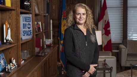 Governor General Julie Payette stands next to a shelf featuring memorabilia from her career as an astronaut, in her office at Rideau Hall in Ottawa on December 11, 2018. Payette Rideau Hall 20190703