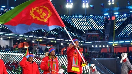 Eritrea flag-bearer Shannon-Ogbani Abeda seen during the opening ceremony of the 2018 Winter Olympic Games in Pyeongchang, South Korea. Born in Fort McMurray, Alta., Abeda experienced a decline in his mental health, triggered by traumatic racial abuse dating back to 2011. 916169344