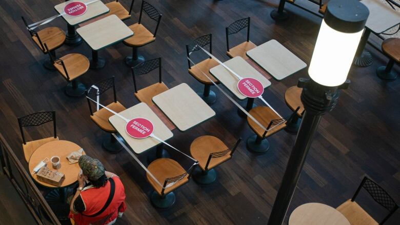 Spaces in a Montreal food court are blocked off to help maintain physical distancing
