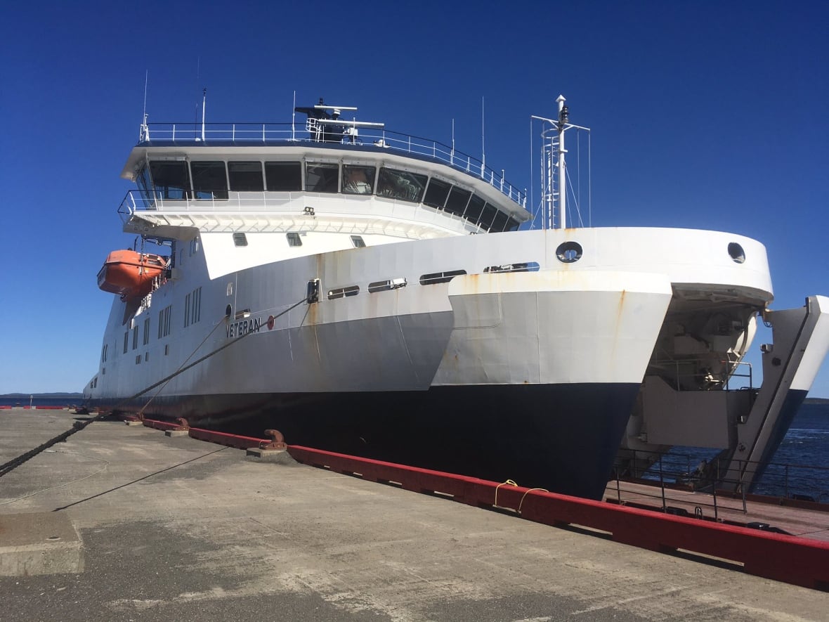 A white and dark blue ferry.