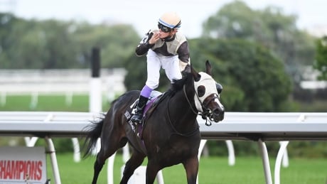 Mighty Heart with jockey Daisuke Fukumoto reacts after winning the running of the 161st Queen's Plate at Woodbine Racetrack in Toronto on Saturday. Mighty-Heart-091220