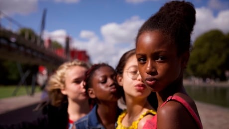 This image released by Netflix shows the cast of the coming-of-age film Cuties. The backlash to the French independent film started before it had even been released because of a poster that went viral for its provocative depiction of its young female actors CP19324997