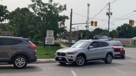 The line up of cars at the Carling Heights assessment centre was backed up to Adelaide Street on Tuesday at noon. The health unit says wait times are about 3 hours. Carling Heights Community Centre line up