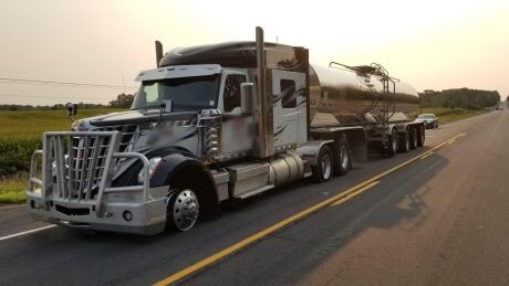 OPP officers successfully intercepted an erratic milk-tanker that refused to stop for police just west of Clinton Wednesday morning. An officer jumped aboard the slow-moving truck and opened the cab to bring the vehicle under control. Milk-tanker-1