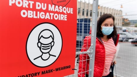 When he announced the alert system, Health Minister Christian Dubé said it would depend on three factors: the epidemiological situation, the rate of transmission and the capacity of the region's health-care system. Mask sign COVID Montreal Sept 15 2020