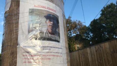 A missing person poster for Thomas Eagleson in the alley leading to the house where police located human remains. Poster