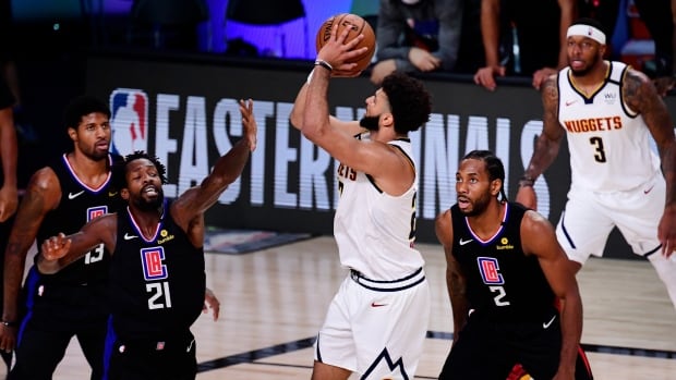 Canada's Jamal Murray, seen above in Game 7 against the Los Angeles Clippers, is showing during the Denver Nuggets' playoff run that he can take some of the most important shots for his team. murray-jamal-091720