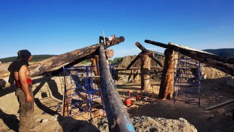 A traditional Tsilhqot'in pit house is dug into the ground, usually in a round shape, with logs and earth to create a domed roof. Tsilhqot'in family pit house 1