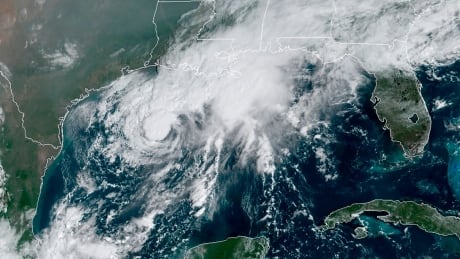 This GOES-16 GeoColor satellite image taken Saturday, Sept. 19, 2020, and provided by NOAA, shows Tropical Storm Beta, center, in the Gulf of Mexico. A hurricane watch is in effect Saturday for coastal Texas as Tropical Storm Beta gains strength. A storm surge watch and a tropical storm watch are also in effect for the area during an exceptionally busy Atlantic hurricane season. Tropical Weather