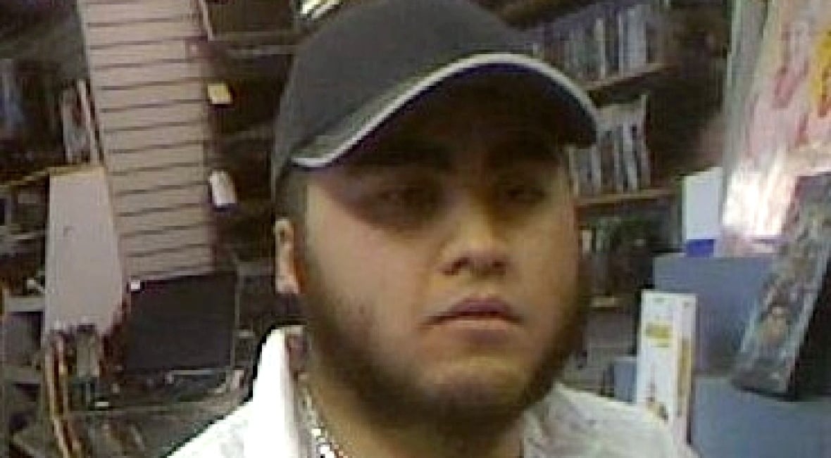 A man in a baseball cap