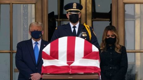 U.S. President Donald Trump and Melania Trump pay respects as Justice Ruth Bader Ginsburg lies in repose at the Supreme Court building on Thursday. Supreme Court Ginsburg