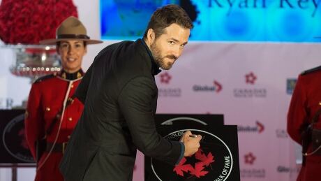 Actor Ryan Reynolds, photographed at his induction into Canada's Walk of Fame in 2014, is dedicating a portion of his salary to finance film industry training for 10 to 20 Black, Indigenous and people of colour on a production beginning in November. CANADA WALK OF FAME 20141018