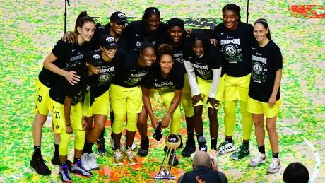 The Seattle Storm pose after winning the WNBA championship following a 92-59 Game 3 victory against the Las Vegas Aces on Tuesday. 1278882551