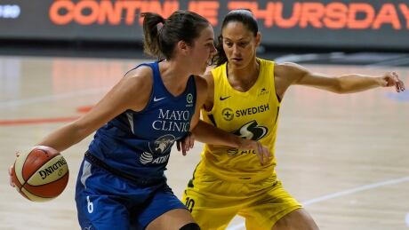 Canadian Minnesota Lynx guard Bridget Carleton, left, drives against Seattle Storm guard Sue Bird during a WNBA playoff game in September. Carleton enjoyed a breakout season during her second year in the league. carleton-bird-101420