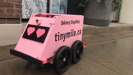 Geoffrey provides contactless delivery in Toronto while being controlled by an employee of Tiny Mile AI using a laptop and video game controller. Geoffrey the robot