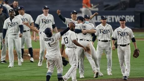 The Tampa Bay Rays celebrate their 4-2 victory over the Houston Astros in Game 7 of their American League Championship Series to advance to the World Series on Saturday. Rays-Astros-171020
