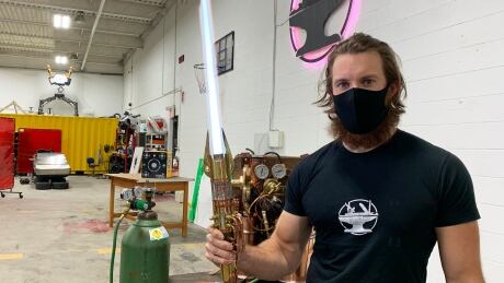 James Hobson and his team spent hundreds of hours building this realistic prototype of a lightsaber. Hobson said this is their fourth prototype. James Hobson lightsaber