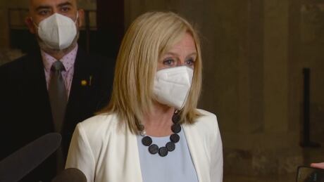 NDP Leader Rachel Notley wears a K95 mask while speaking to reporters at the Alberta legislature on Thursday. Notley and her caucus switched from cloth to the medical grade masks after five MLAs, including the premier, were forced into isolation after Municipal Affairs Minister Tracy Allard tested positive for COVID-19. Notley K95