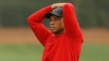 Tiger Woods, the defending Masters champion, knocked three balls into the water at the
par-3 12th hole Sunday on the way to a septuple-bogey 10, his worst score ever at Augusta National. woods-tiger-201115-1180