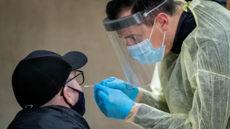 Rapid covid testing, Dalhousie Campus, Halifax, NS on Tuesday, 24 Nov 2020. See technician in hazmat clothing performing nasal swab test. Rapid Covid Testing
