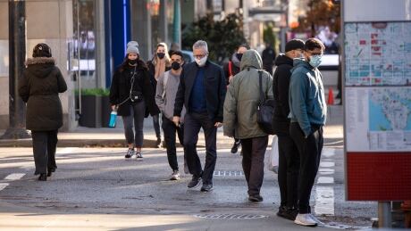 People are pictured in downtown Vancouver, British Columbia on Tuesday, December 1, 2020. COVID-19 DAILY FEATURES - DECEMBER 1, 2020