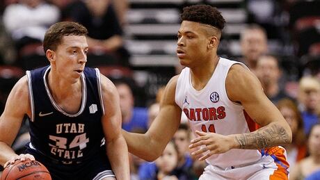 Florida basketball player Keyontae Johnson, right, collapsed on the court Saturday. Johnson had the coronavirus in the summer that could cause myocarditis, a viral infection of the heart muscle that can lead to sudden cardiac arrest. johnson-keyontae-191221-1180