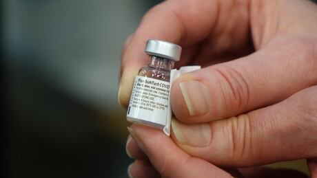 A vial of the Pfizer-BioNTech COVID-19 vaccine after it's diluted and ready to be injected. The vaccine has to be stored at ultra-low freezing temperatures, but is warmed up to room temperature before being injected. COVID-19 vaccine