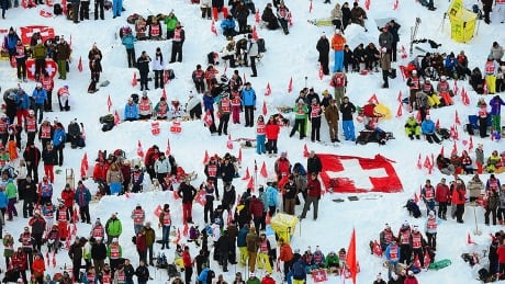 The classic men's downhill at Wengen, scheduled for this Saturday in Switzerland, was cancelled Monday due to a rise in COVID-19 cases. The race typically attracts a crowd of about 30,000. wengen-skiing-130119-1180