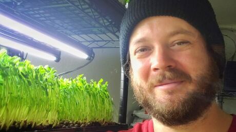 Jon Cleveland in his 'bunker' — a basement space where he grows greens for salad mixes. When the pandemic hit, I started growing my own food. Now I've turned it into a small business Image 1