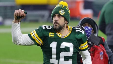 Aaron Rodgers of the Green Bay Packers celebrates after his team's 32-18 win over the Los Angeles Rams in the NFC divisional playoff game on Saturday at Lambeau Field in Green Bay, Wis. Packers2021