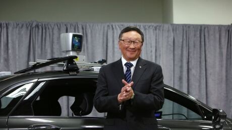 John Chen, chief executive officer of BlackBerry Ltd., stands in front of a Ford Motor Co. Lincoln MKZ vehicle with a Blackberry autonomous driving system installed at the BlackBerry QNX headquarters in Ottawa, Ontario, Canada, on Friday, Feb. 15, 2019. The Canadian government is pledging C$40 million ($30 million) in funding for BlackBerry to fund research and hiring in autonomous vehicles. Photographer: David Kawai/Bloomberg BlackBerry John Chen self driving