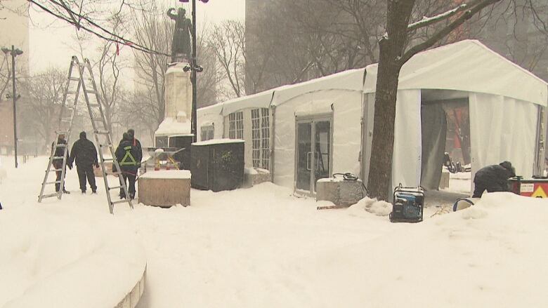 Warming tent in Cabot Square honours Raphaël André, who died steps