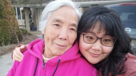 Emily Tang (right) said her grandmother Fenglan Ge (left) was her main caregiver growing up as her single mom worked long hours at a hospital and now works with social services. Fenglan Ge and Emily Tang