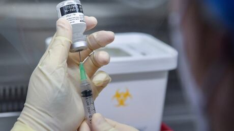 A nurse fills a syringe with the Pfizer-BioNTech COVID-19 vaccine at the National Medical Center vaccination center in Seoul Saturday, Feb. 27, 2021. Virus Outbreak South Korea