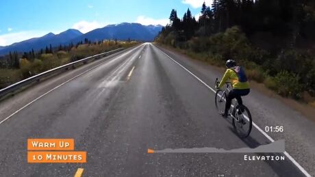 A screen capture from a Yukon Spin video shows a cyclist heading out on the South Klondike Highway. Yukon Spin