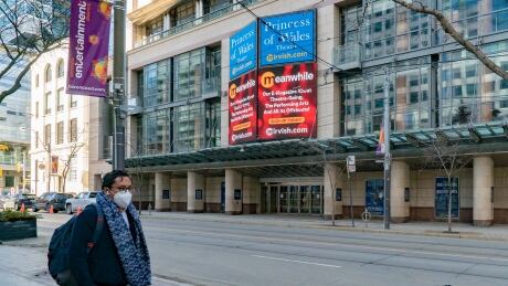 A man walks on the sidewalk opposite the Princess of Wales Theatre in downtown Toronto on Thursday, March 4, 2021. (Sam Nar/CBC)
A man walking past the Princess of Wales Theatre
